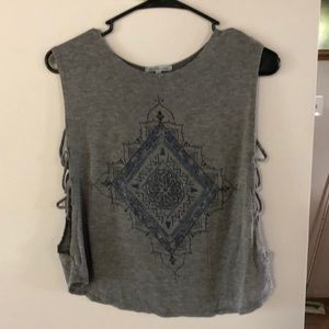 Sleeveless shirt with cutouts
